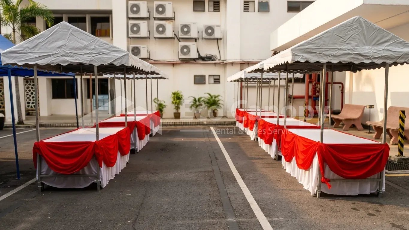 White canvas roof hawker stalls with red and white scallop skirting in an outdoor car park